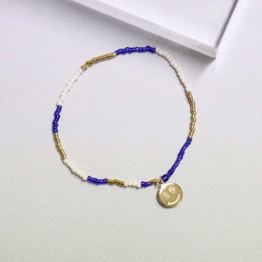 0330 []  18k   Smile charm 18k gold beads bracelet